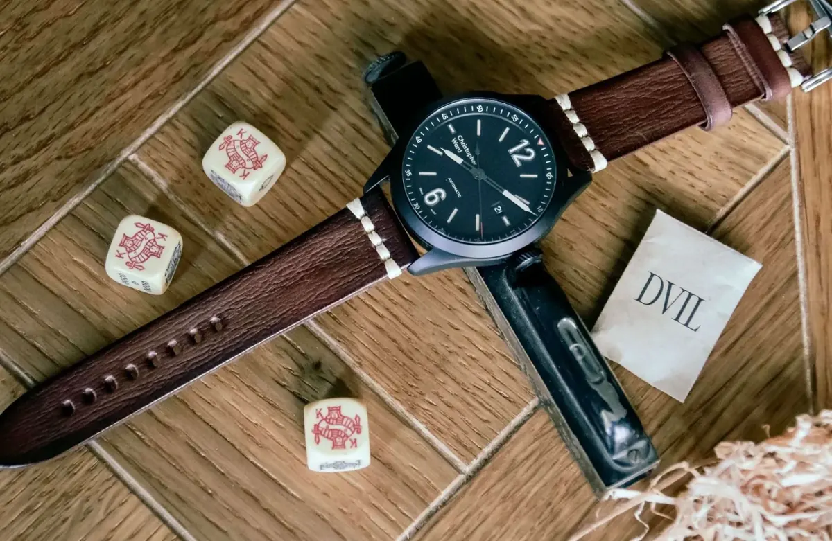 Hand-stitched leather watch strap detail Close-up of hand-stitched leather watch strap with brass buckle